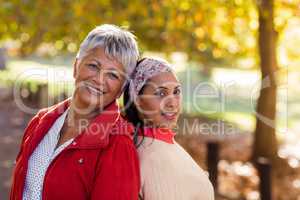 Portrait of mature mother with daughter at park
