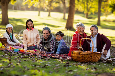 Portrait of family relaxing at park