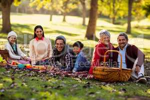 Portrait of family relaxing at park