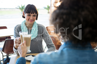 Couple toasting glass of cold coffee