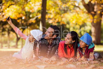 Happy family taking selfie at park