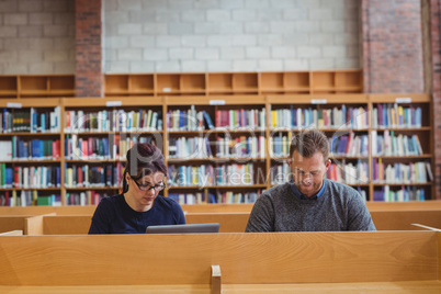 Mature students using laptop to help with studying