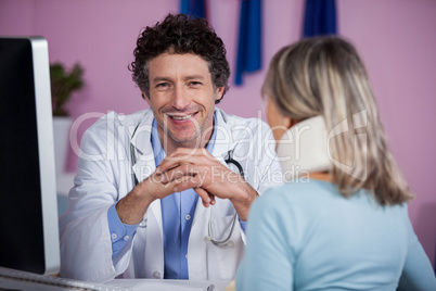 Physiotherapist talking to a patient