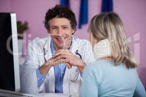 Physiotherapist talking to a patient