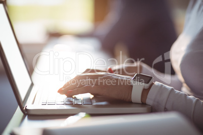 Close-up of student using laptop