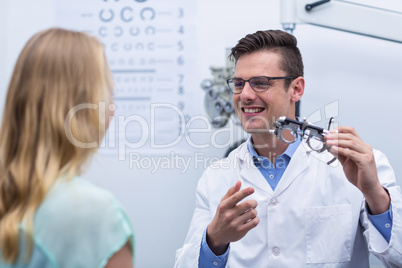 Optometrist discussing on messbrille with female patient