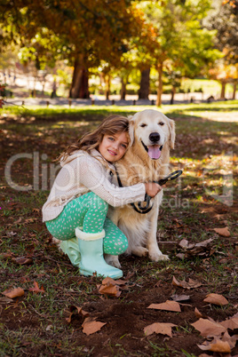 Little girl posing with her dog