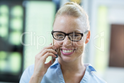 Female customer talking on mobile phone