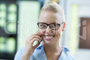 Female customer talking on mobile phone