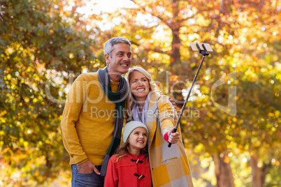 Family taking selfie against trees