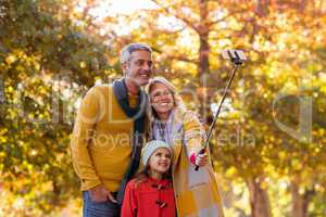 Family taking selfie against trees