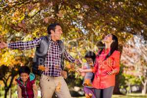 Happy family enjoying during autumn