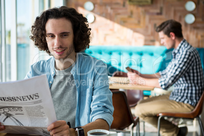 Man reading a business newspaper