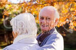 Portrait of a senior man with his wife in foreground