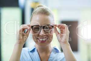 Close-up of female customer trying spectacles
