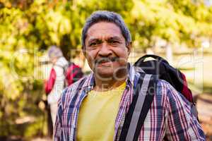 Portrait of man holding a backpack