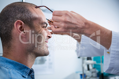 Female optometrist prescribing spectacles to patient