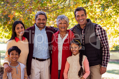 Portrait of multi-generation family standing at park