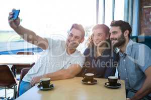 Friends taking a selfie in the coffee shop