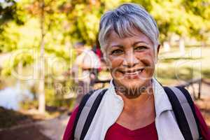 Portrait of woman holding a backpack