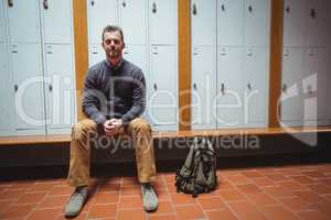 Mature student sitting in the locker room