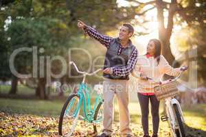 Smiling couple with bicycles