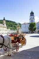 Horse-drawn carriage on the main market of Salzburg