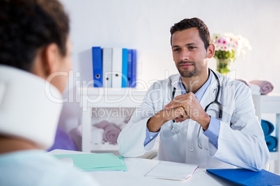 Physiotherapist talking to a patient