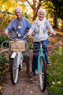 Senior couple riding their bike