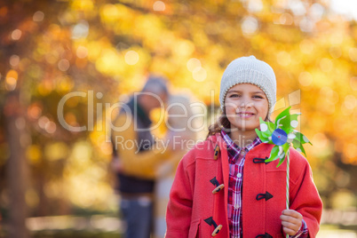 Portrait of smiling girl holding pinwheel toy