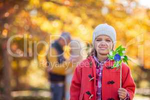 Portrait of smiling girl holding pinwheel toy