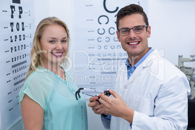 Portrait of female patient and optometrist
