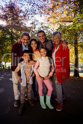 Full length of multi-generation family standing at park