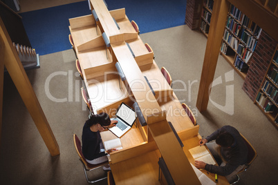 Mature student studying in library