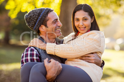 Man carrying woman