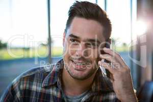 Handsome man talking on the phone