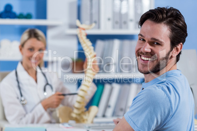 Portrait of physiotherapist and male patient