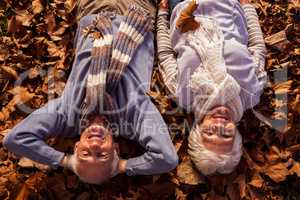 Senior couple lying on the ground