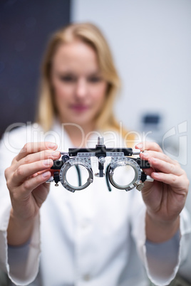 Close-up of optometrist holding messbrille