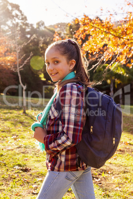 Portrait of happy girl hiking at park