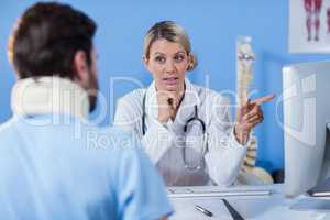 Physiotherapist interacting with patient