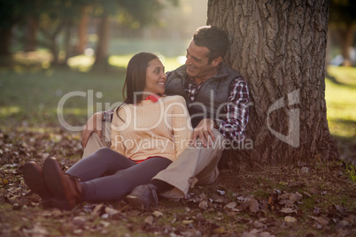 Happy couple talking at park