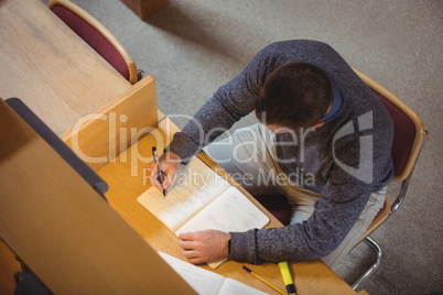 Mature student studying in library