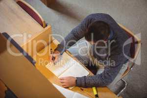 Mature student studying in library