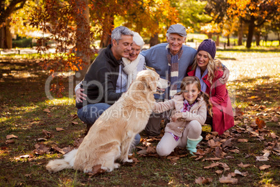 Smiling family with their dog