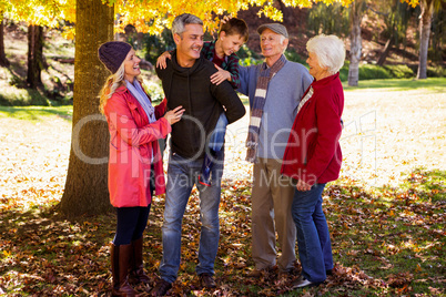 Smiling family and the father holding his son