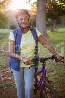 Woman holding her bike