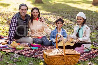 Portrait of family relaxing at park