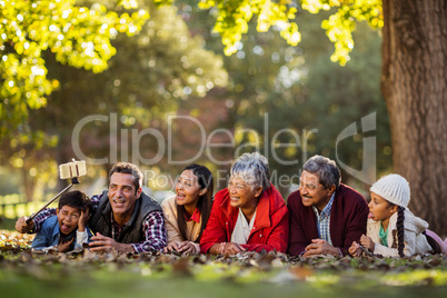 Man with joyful family taking selfie