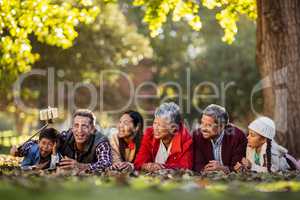 Man with joyful family taking selfie